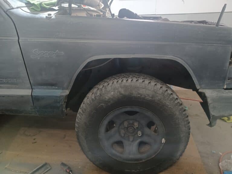 aftermarket vs stock steel wheels on 1998 Jeep Cherokee Sport