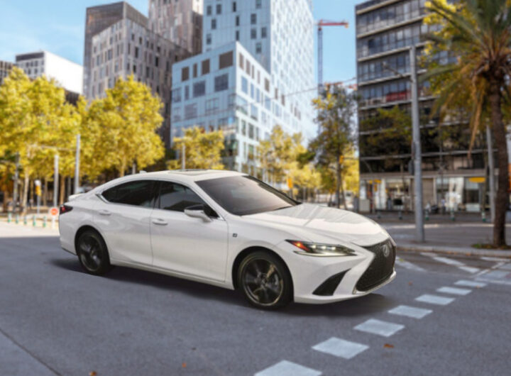 2025 Lexus ES white driving on city street