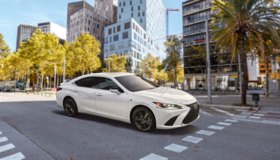 2025 Lexus ES white driving on city street